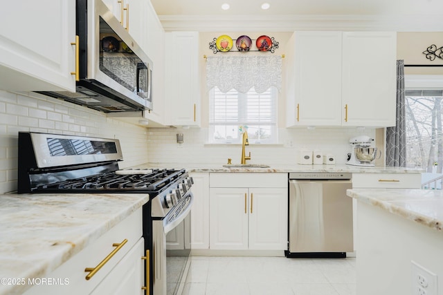 19 Summerhill Ave, Jackson, NJ 08527 - kitchen with stainless steel appliances, light stone countertops, white cabinetry, and a sink
