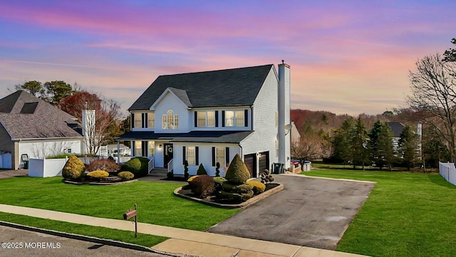 19 Summerhill Ave, Jackson, NJ 08527 - traditional-style home featuring a garage, a front yard, fence, and aphalt driveway