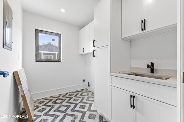 18 Seaview Ave, Long Branch, NJ 07740 - washroom with baseboards, cabinet space, light flooring, and recessed lighting