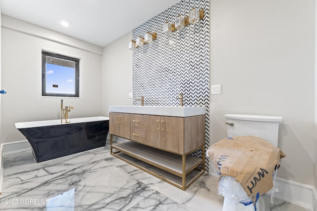 18 Seaview Ave, Long Branch, NJ 07740 - full bathroom with a freestanding tub, double vanity, marble finish floors, and recessed lighting