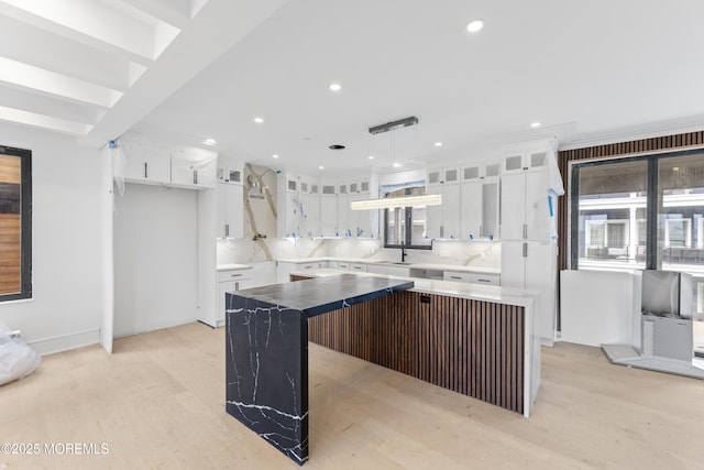 18 Seaview Ave, Long Branch, NJ 07740 - kitchen featuring a center island, a sink, light wood-style floors, recessed lighting, and white cabinets