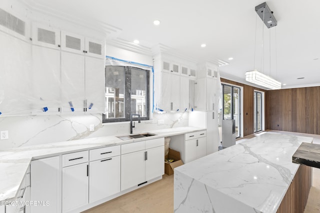 18 Seaview Ave, Long Branch, NJ 07740 - kitchen with a sink, white cabinets, ornamental molding, a kitchen island, and hanging light fixtures