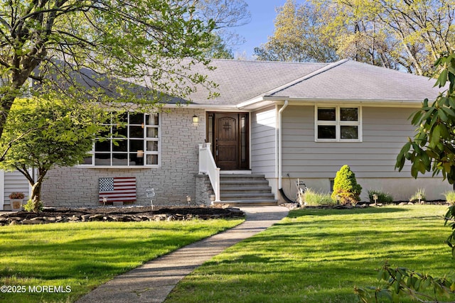 113 Parker Rd, West Long Branch, NJ 07764 - view of front of house with entry steps, roof with shingles, and a front yard