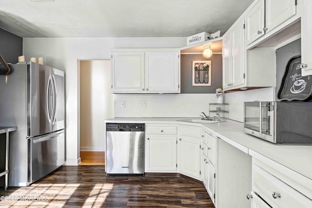 113 Parker Rd, West Long Branch, NJ 07764 - kitchen featuring stainless steel appliances, a sink, white cabinetry, dark wood-type flooring, and light countertops