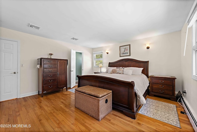 113 Parker Rd, West Long Branch, NJ 07764 - bedroom with a baseboard heating unit, baseboards, light wood-style flooring, and visible vents