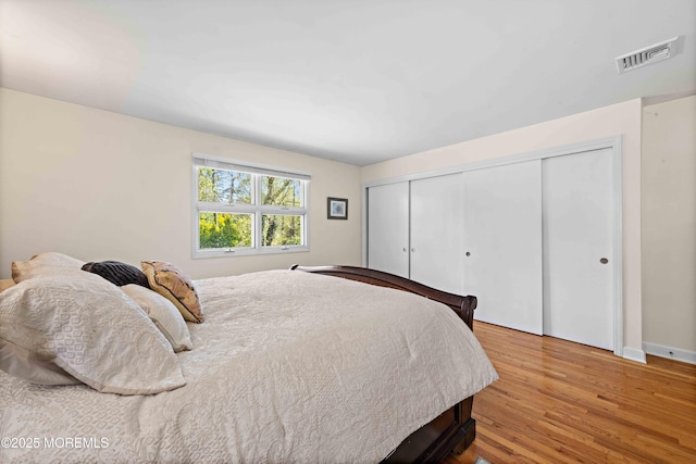 113 Parker Rd, West Long Branch, NJ 07764 - bedroom featuring baseboards, a closet, visible vents, and wood finished floors