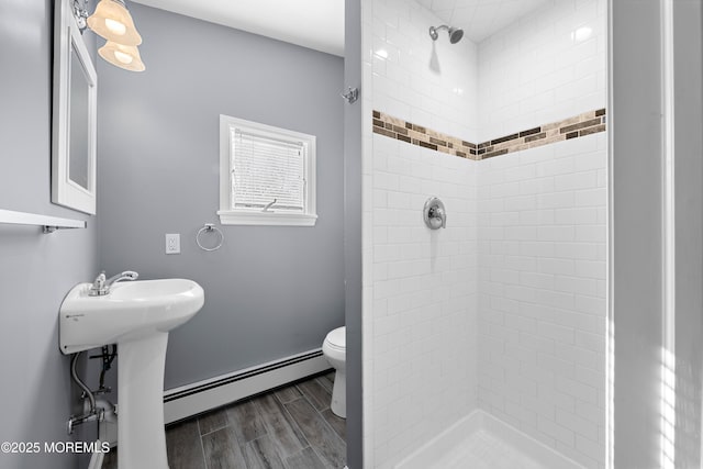 113 Parker Rd, West Long Branch, NJ 07764 - full bathroom featuring a stall shower, toilet, a baseboard radiator, and wood finish floors
