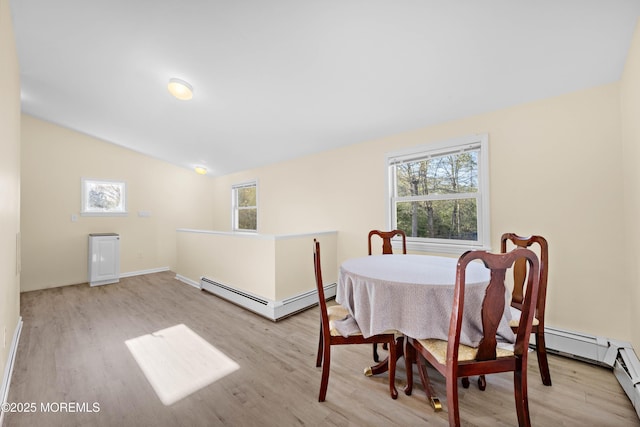 113 Parker Rd, West Long Branch, NJ 07764 - dining room featuring lofted ceiling, a wealth of natural light, baseboard heating, and wood finished floors