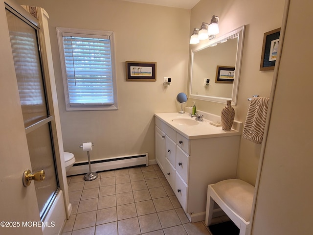 bathroom with baseboard heating, tile patterned flooring, vanity, toilet, and baseboards