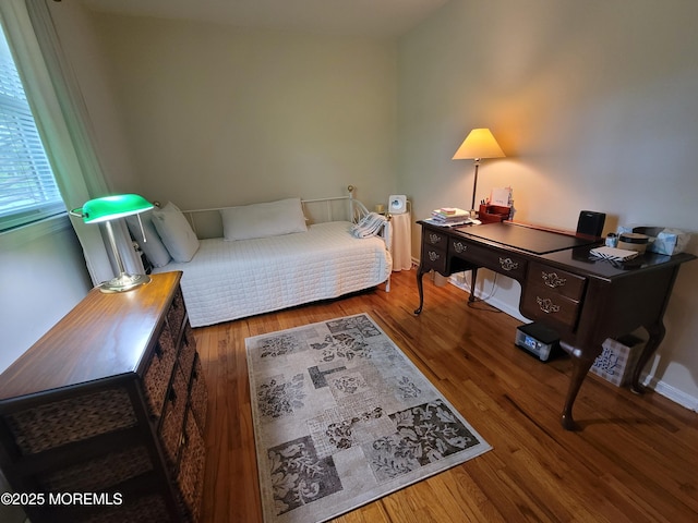 bedroom with wood finished floors