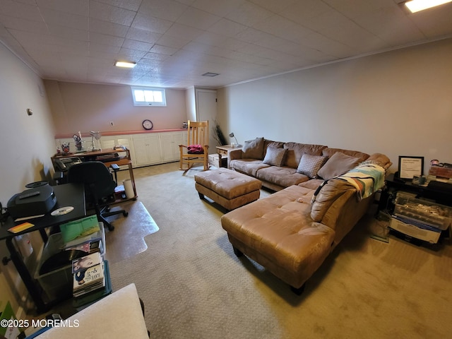 living room with ornamental molding and light carpet