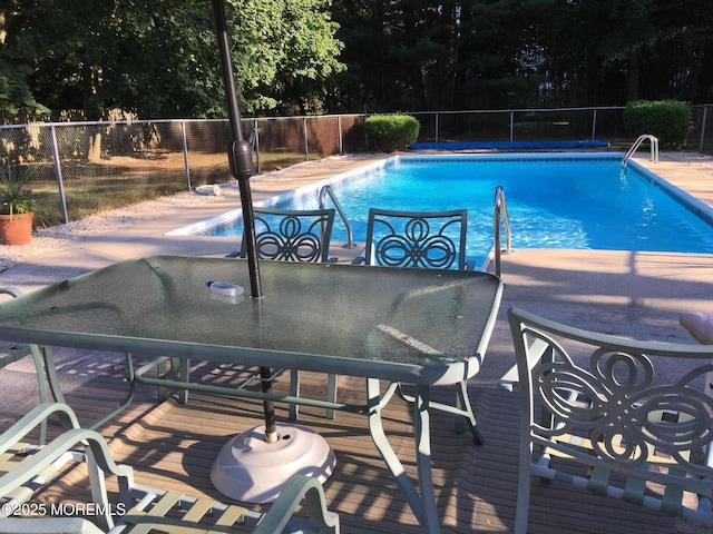 54 E Riverdale Ave, Tinton Falls, NJ 07724 - view of swimming pool with view of wooded area