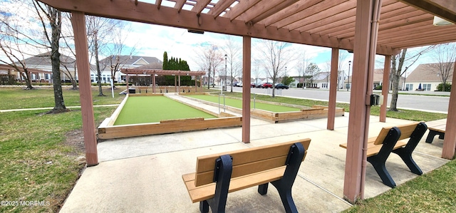 view of patio / terrace with a pergola and a residential view