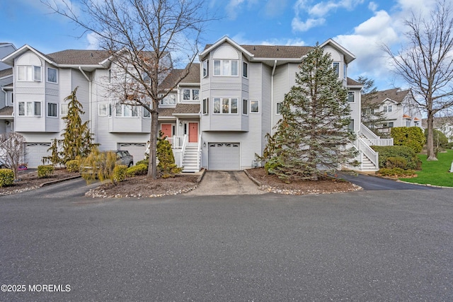 265 Marigold Ct, Toms River, NJ 08757 - view of front of house featuring a residential view, driveway, a garage, and stairway