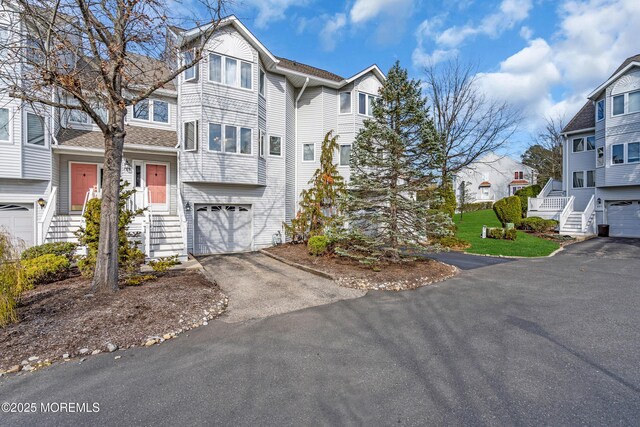 265 Marigold Ct, Toms River, NJ 08757 - view of front facade featuring a residential view, driveway, and a garage