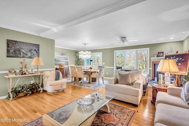 265 Marigold Ct, Toms River, NJ 08757 - living room featuring baseboards, ornamental molding, ceiling fan with notable chandelier, and hardwood / wood-style flooring