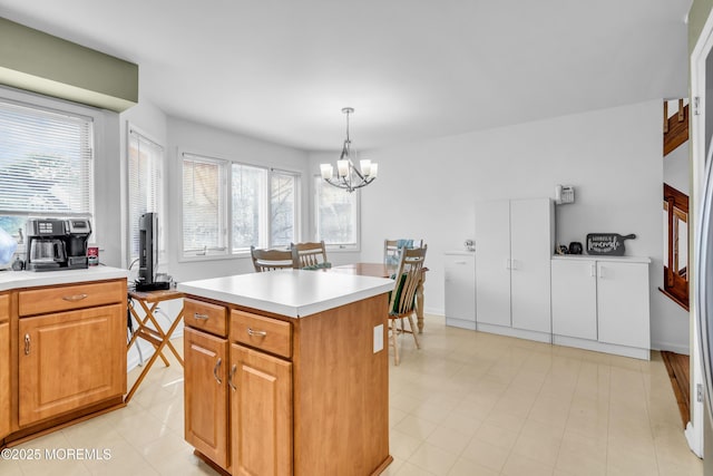 265 Marigold Ct, Toms River, NJ 08757 - kitchen featuring pendant lighting, light countertops, a chandelier, and a kitchen island