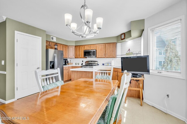 265 Marigold Ct, Toms River, NJ 08757 - dining room featuring baseboards, visible vents, and an inviting chandelier