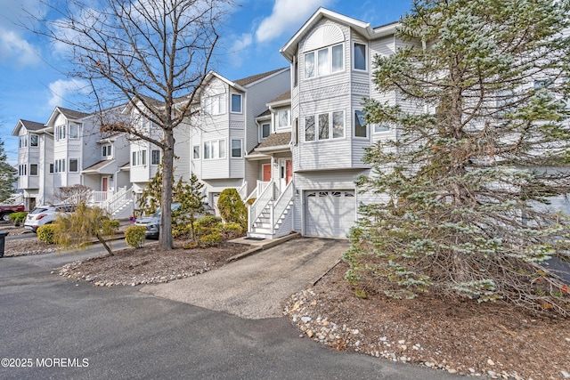 265 Marigold Ct, Toms River, NJ 08757 - multi unit property featuring a residential view, an attached garage, and aphalt driveway