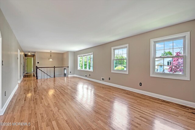 7 Mill Rd, Jamesburg, NJ 08831 - unfurnished room featuring baseboards and light wood-style floors