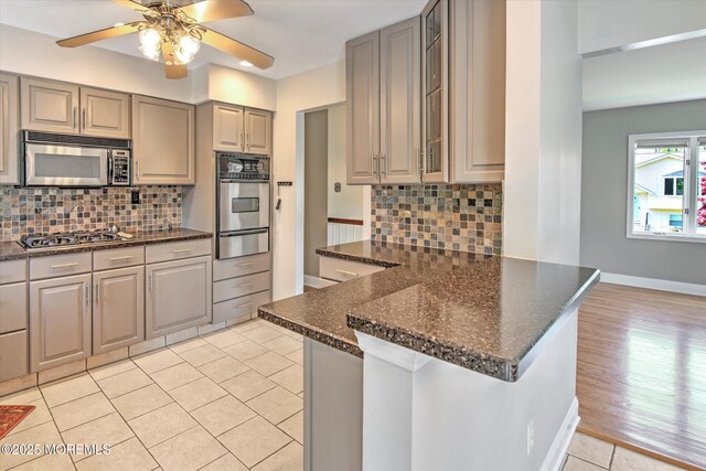 7 Mill Rd, Jamesburg, NJ 08831 - kitchen with a warming drawer, gray cabinets, ceiling fan, and stainless steel appliances