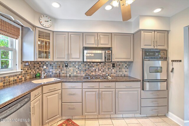 7 Mill Rd, Jamesburg, NJ 08831 - kitchen with a sink, gray cabinets, a warming drawer, dark countertops, and appliances with stainless steel finishes