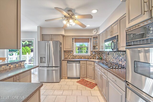 7 Mill Rd, Jamesburg, NJ 08831 - kitchen with a sink, stainless steel appliances, a warming drawer, backsplash, and dark countertops