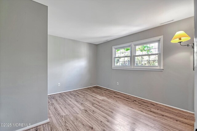 7 Mill Rd, Jamesburg, NJ 08831 - empty room with baseboards, visible vents, and wood finished floors