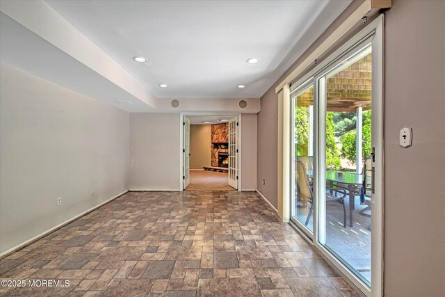 7 Mill Rd, Jamesburg, NJ 08831 - spare room featuring baseboards, stone finish flooring, a fireplace, and recessed lighting