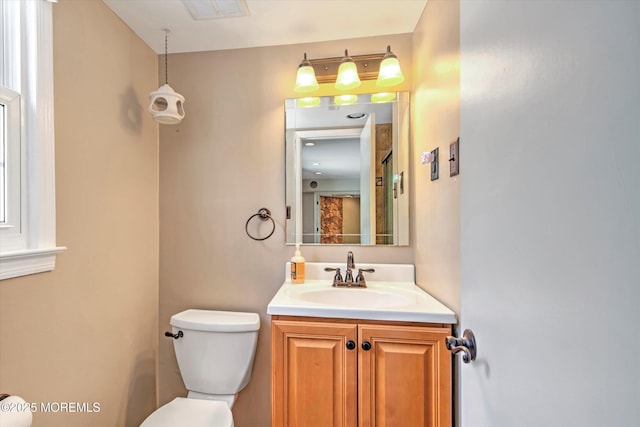 7 Mill Rd, Jamesburg, NJ 08831 - bathroom featuring toilet, visible vents, and vanity