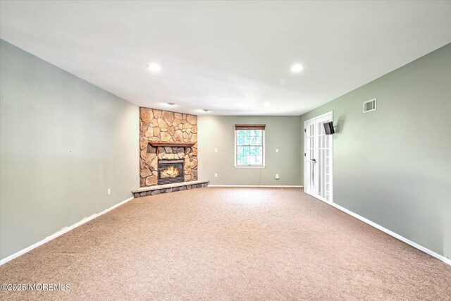 7 Mill Rd, Jamesburg, NJ 08831 - unfurnished living room with carpet flooring, a fireplace, visible vents, and baseboards