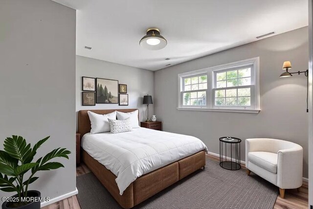 7 Mill Rd, Jamesburg, NJ 08831 - bedroom featuring visible vents, wood finished floors, and baseboards