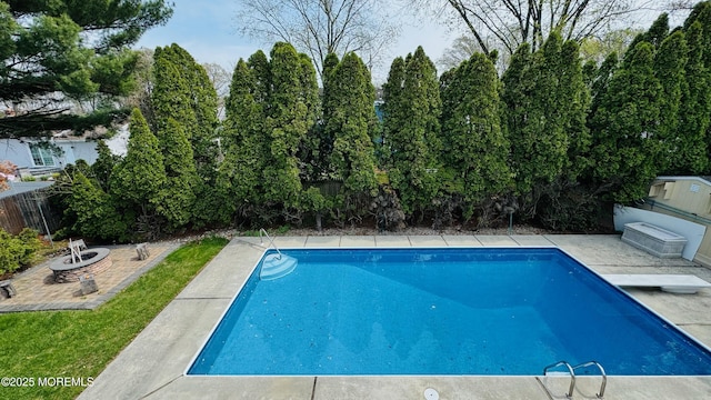 7 Mill Rd, Jamesburg, NJ 08831 - view of pool featuring a patio area, a diving board, a fenced in pool, a fenced backyard, and a fire pit