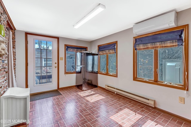 148 Royal Dr, Brick, NJ 08723 - unfurnished room featuring brick floor, baseboards, a wall mounted air conditioner, and a baseboard heating unit