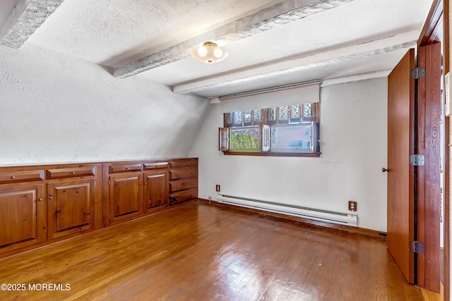 148 Royal Dr, Brick, NJ 08723 - additional living space featuring a textured ceiling, vaulted ceiling with beams, a baseboard heating unit, and light wood finished floors