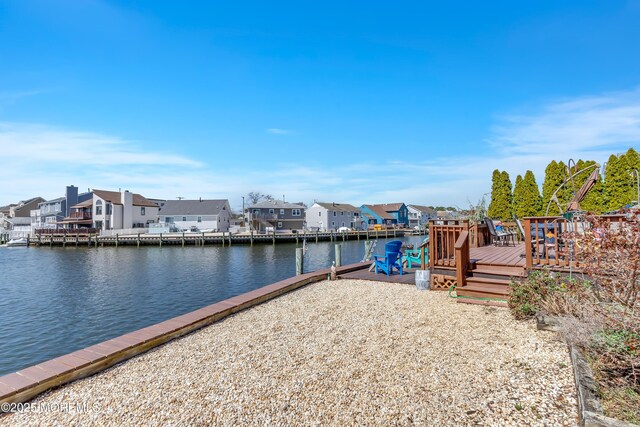 148 Royal Dr, Brick, NJ 08723 - dock area with a deck with water view and a residential view