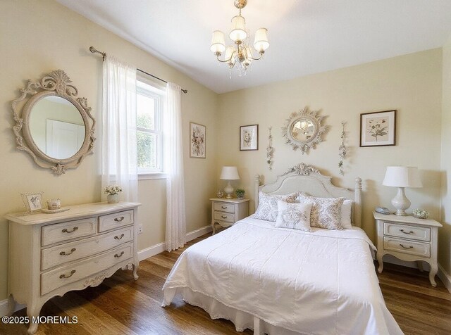 3 W Potomac Dr, Little Egg Harbor, NJ 08087 - bedroom with a chandelier and dark wood-style floors