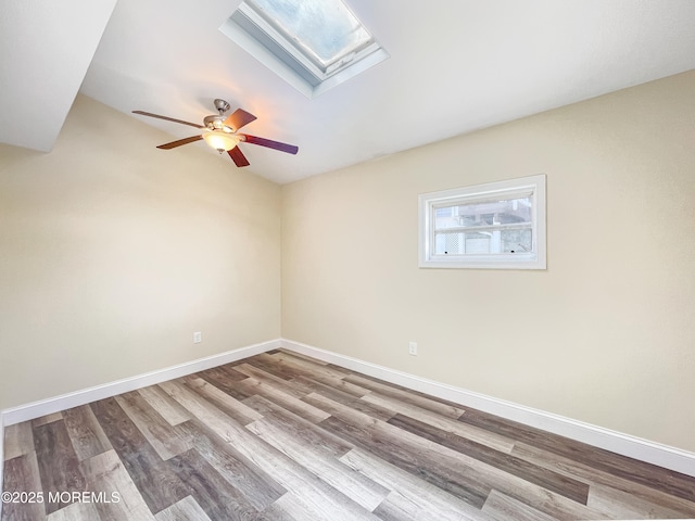 3 W Potomac Dr, Little Egg Harbor, NJ 08087 - spare room with wood finished floors, ceiling fan, and a skylight