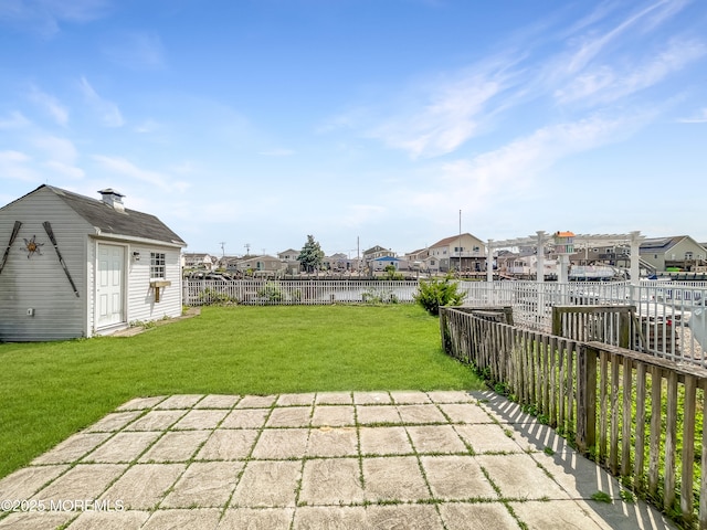 3 W Potomac Dr, Little Egg Harbor, NJ 08087 - fenced backyard with an outbuilding, a residential view, and a patio area