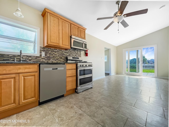 3 W Potomac Dr, Little Egg Harbor, NJ 08087 - kitchen featuring stainless steel appliances, decorative backsplash, lofted ceiling, ceiling fan, and hanging light fixtures
