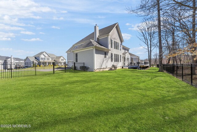 61 Windermere Rd, Lincroft, NJ 07738 - exterior space with central air condition unit, a fenced backyard, a shingled roof, a yard, and a chimney