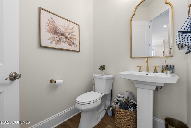 61 Windermere Rd, Lincroft, NJ 07738 - half bath with baseboards, wood finished floors, and toilet