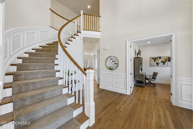 61 Windermere Rd, Lincroft, NJ 07738 - staircase featuring a decorative wall, a wainscoted wall, and wood finished floors