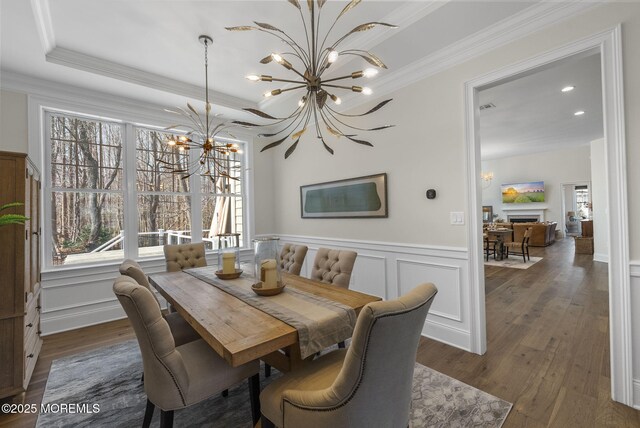 61 Windermere Rd, Lincroft, NJ 07738 - dining space with ornamental molding, dark wood finished floors, a decorative wall, a notable chandelier, and a fireplace