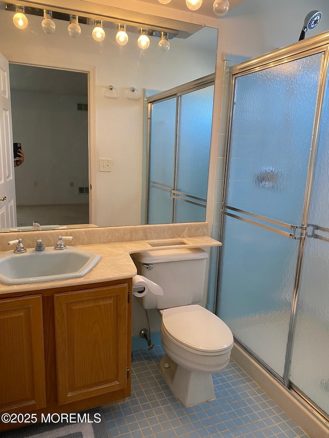 1042A Canterbury Dr, Manchester, NJ 08759 - bathroom featuring vanity, visible vents, toilet, and a shower stall