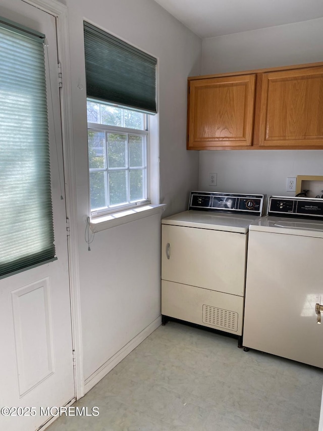 1042A Canterbury Dr, Manchester, NJ 08759 - washroom featuring cabinet space, baseboards, separate washer and dryer, and light floors