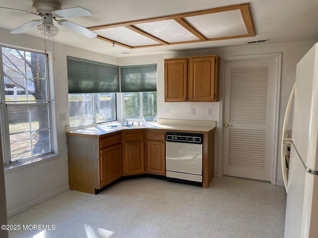 1042A Canterbury Dr, Manchester, NJ 08759 - kitchen featuring light countertops, visible vents, light floors, and white appliances