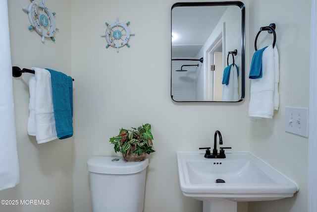 bathroom featuring a sink and toilet