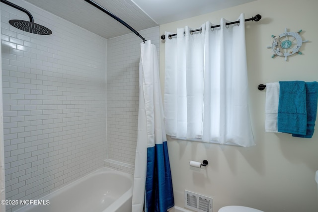 full bathroom featuring shower / bathtub combination with curtain and visible vents