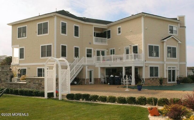 300 W Concourse, Neptune Township, NJ 07753 - rear view of house with a balcony, stairway, and a lawn